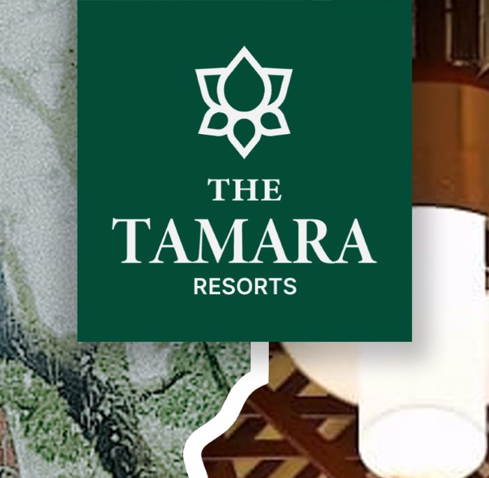 Detail: The Tamara Resorts logo on its green hanging tag, over a torn-paper edge