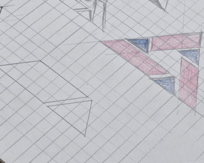 Close-up of a pencil triangle shaded in red and blue, with construction lines around it