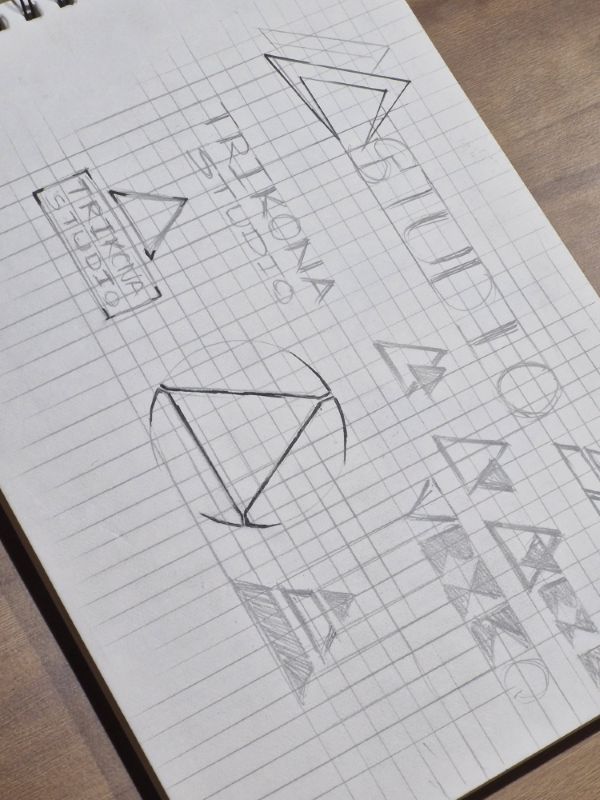 Sketchbook page testing the TRIKONA wordmark next to triangle symbols